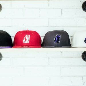 four assorted fitted caps on shelf